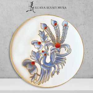 Piatto in porcellana con pittura color oro